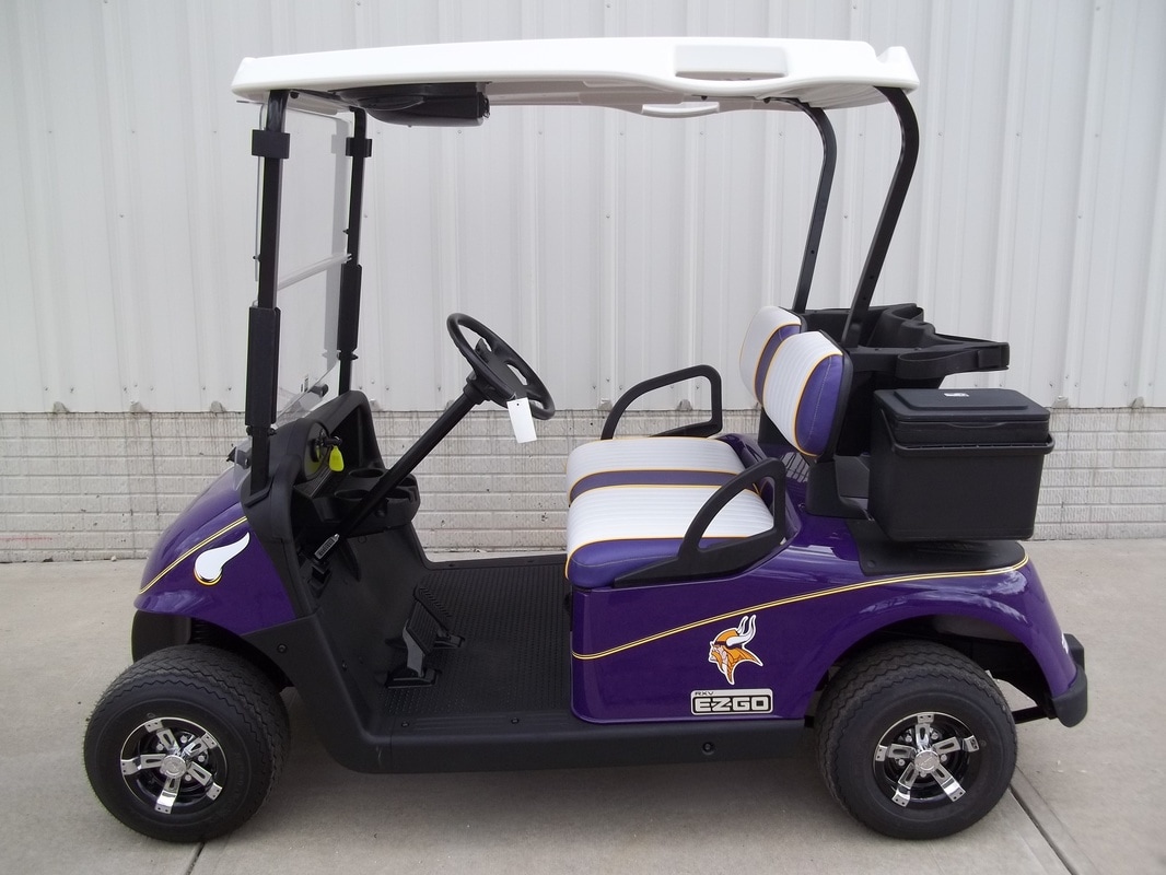 2012 E-Z-GO RXV Custom Painted Purple with Vikings Decals, Custom White & Purple Seats with Yellow Piping & Stitching, Electric 48-V (6-8V) Trojan Batteries, White Top, Bluetooth Radio, Yellow Pinstripe, Clear Folding Windshield, Deluxe Cooler, Side Basket, Vegas Hubcaps